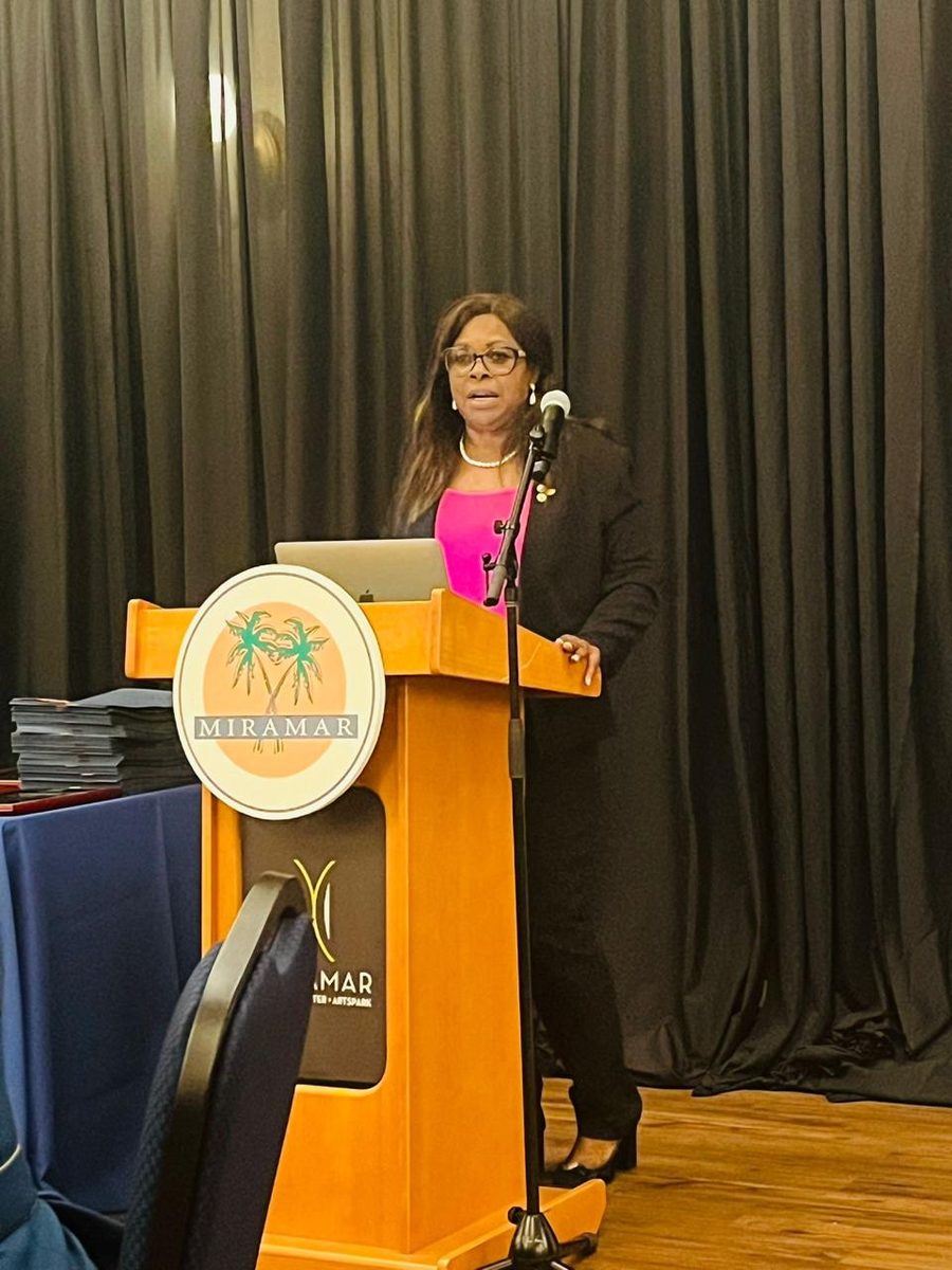 Dr. Sonia Hylton speaking at a podium in Miramar, Florida